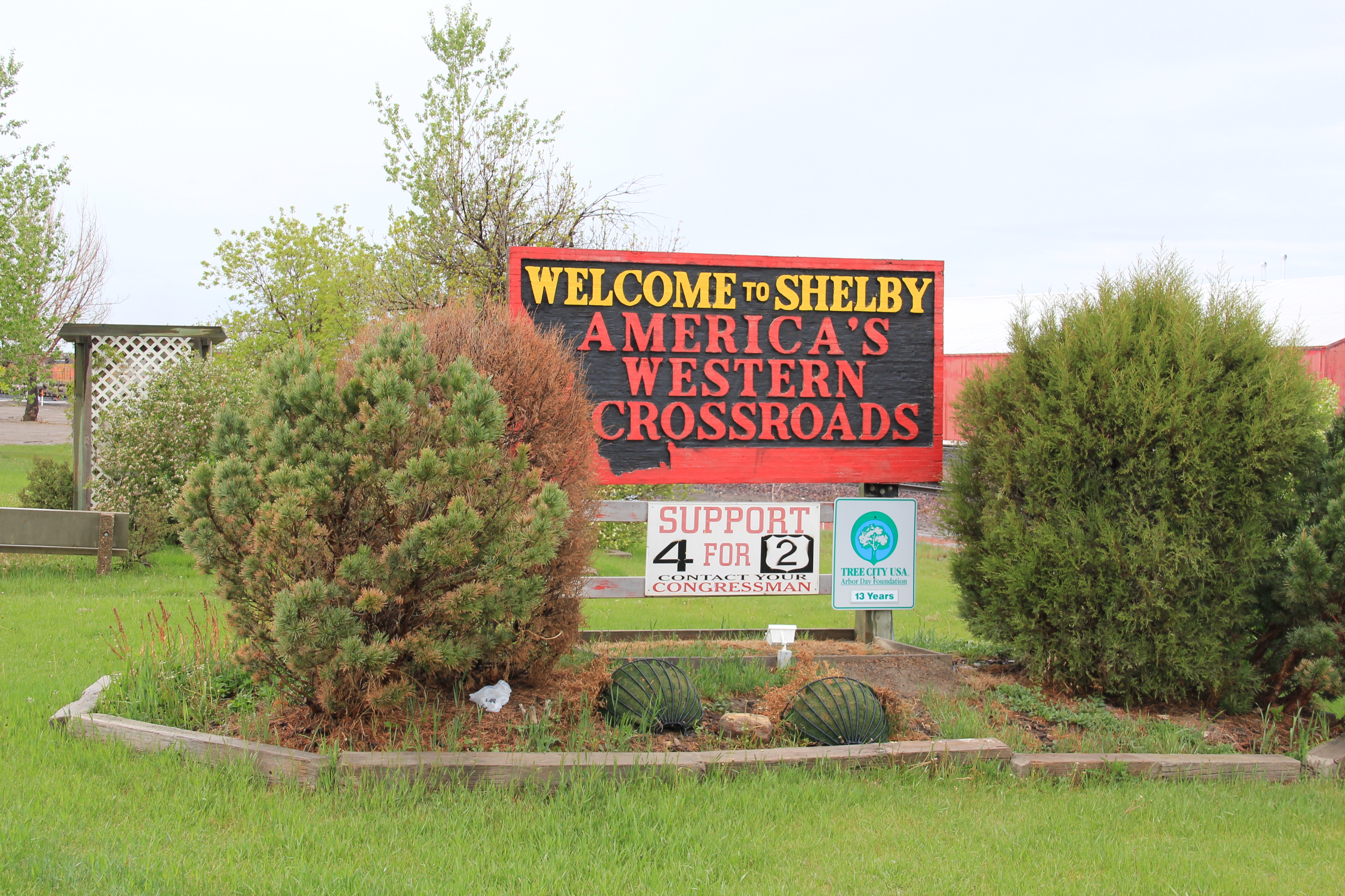 Toole Co Shelby sign and BNSF train